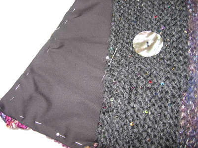 The lining is fitted to the knitting and hand sewn in place
